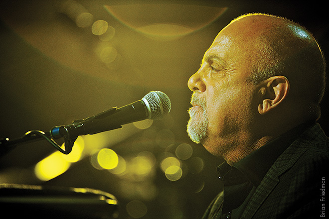 billy joel, 2012 Billy performed “Movin’ Out” at the Concert for Sandy Relief in New York City. The staging was subdued in keeping with the purpose of the event. I picked up some light that was coming from behind him, and it reminded me of sunshine. 