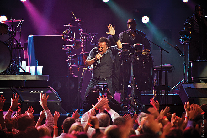 Bruce Springsteen, 2012 Bruce performed “Land of Hope and Dreams,” at the Concert for Sandy Relief. I picked a spot where I could skim the fans—getting hands in frame to capture more of the action. He bonded with the audience—and lit up the crowd. 